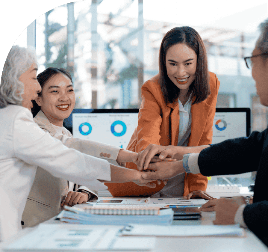 Team members joining hands during a demand forecasting session