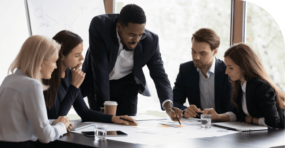 Business professionals discussing project portfolio reports