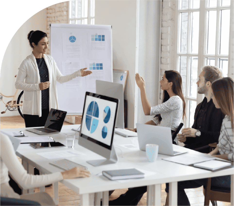 Team reviewing performance charts and portfolio priorities in a meeting