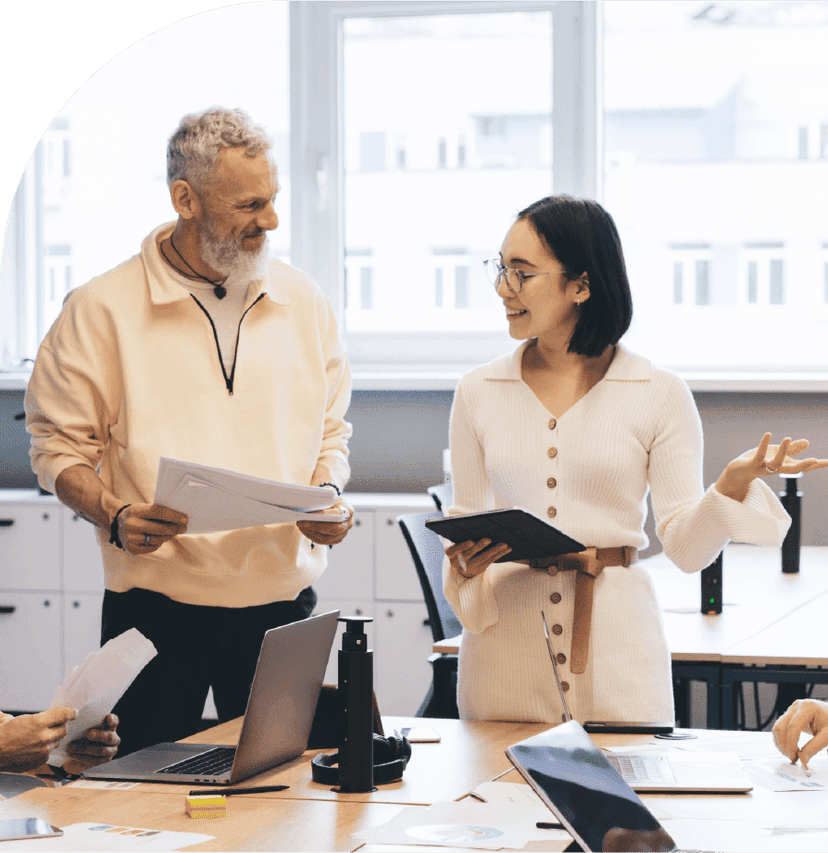 Business professionals discussing workforce schedules during an office meeting