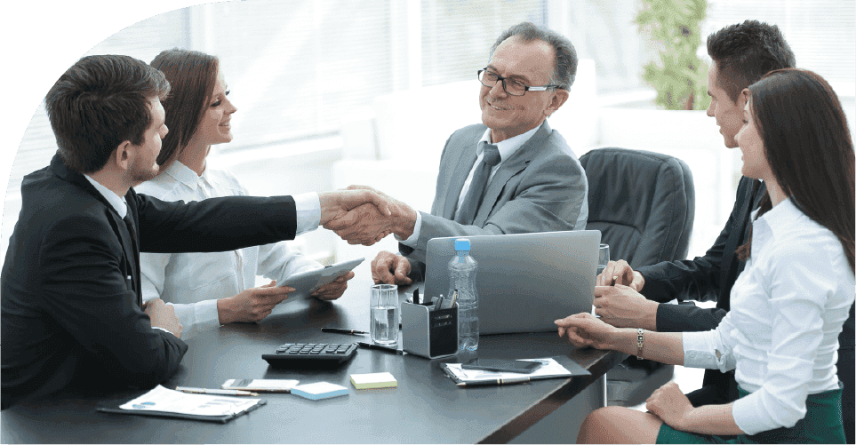 Team finalizing a equipment scheduling plan with a handshake