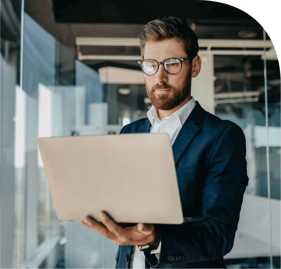 Business professional reviewing project profitability on a laptop